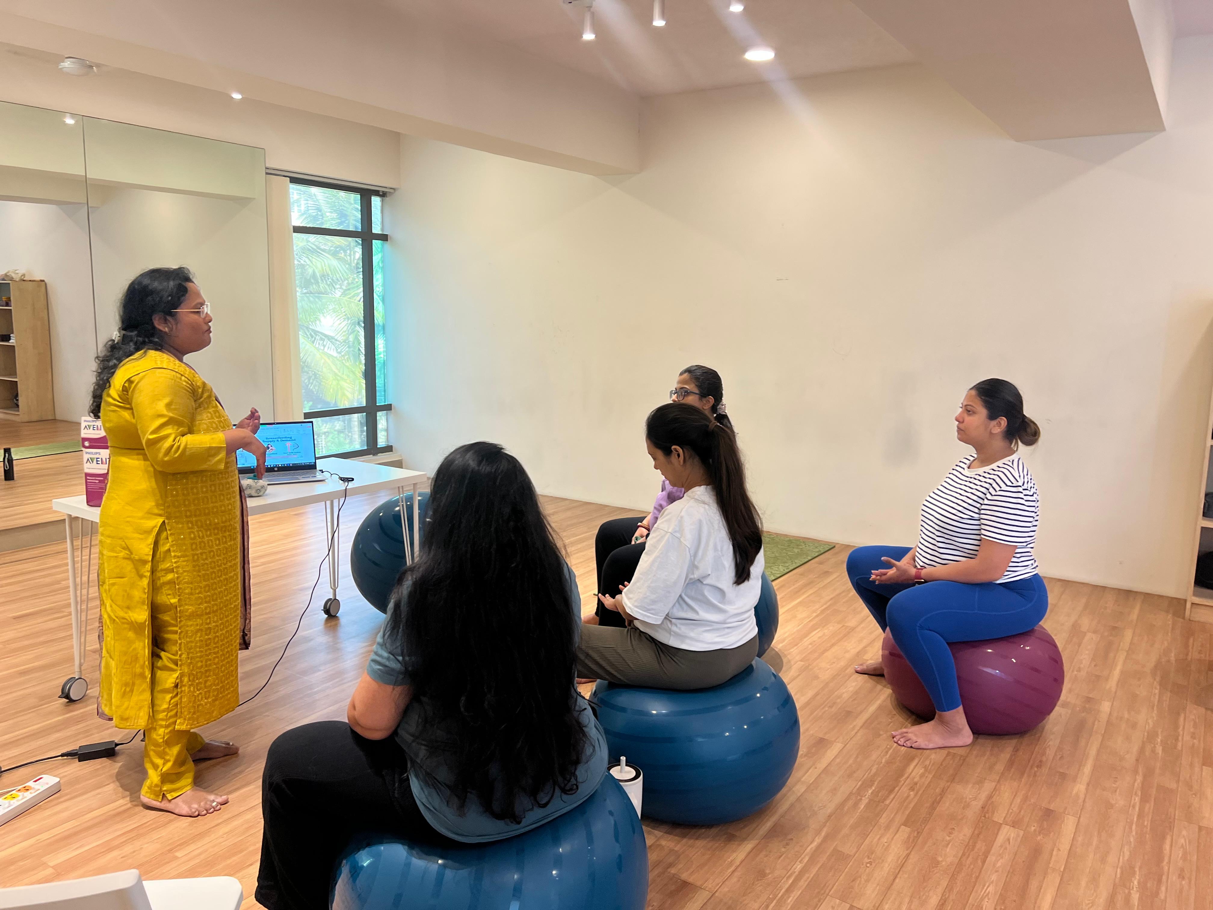 Mother breastfeeding, emphasizing the benefits beyond the bond, in the Aura Breastfeeding Workshop.